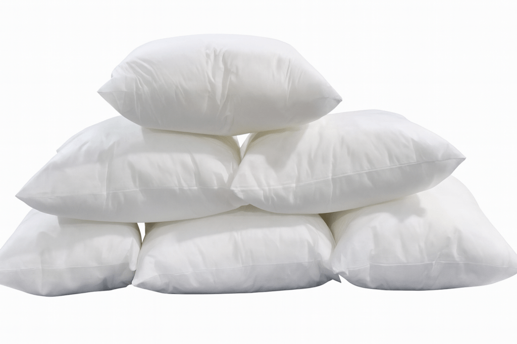 Stack of white cushion inserts.